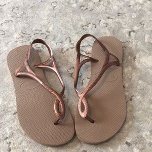 Bronze flip flops